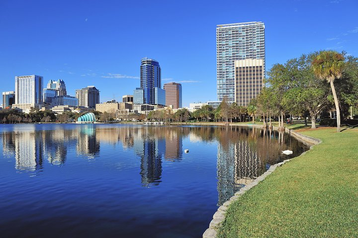 Experience the charm of Orlando as you glide across tranquil waters capturing stunning reflections of the city skyline and lush parks perfect for an unforgettable day of exploration.